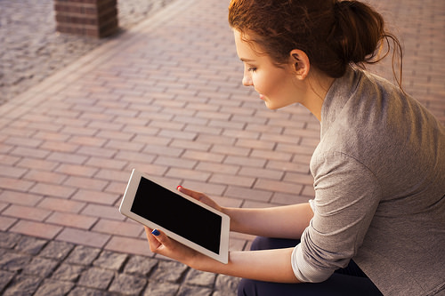 Millennial holding tablet